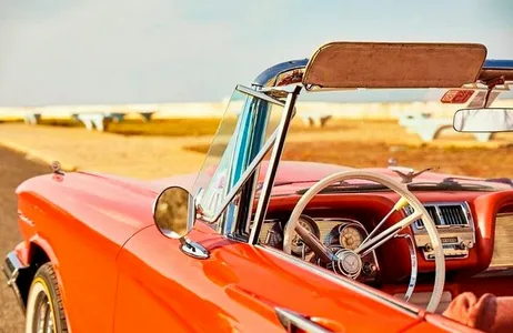 Cannon shooting at vintage cars and dinner